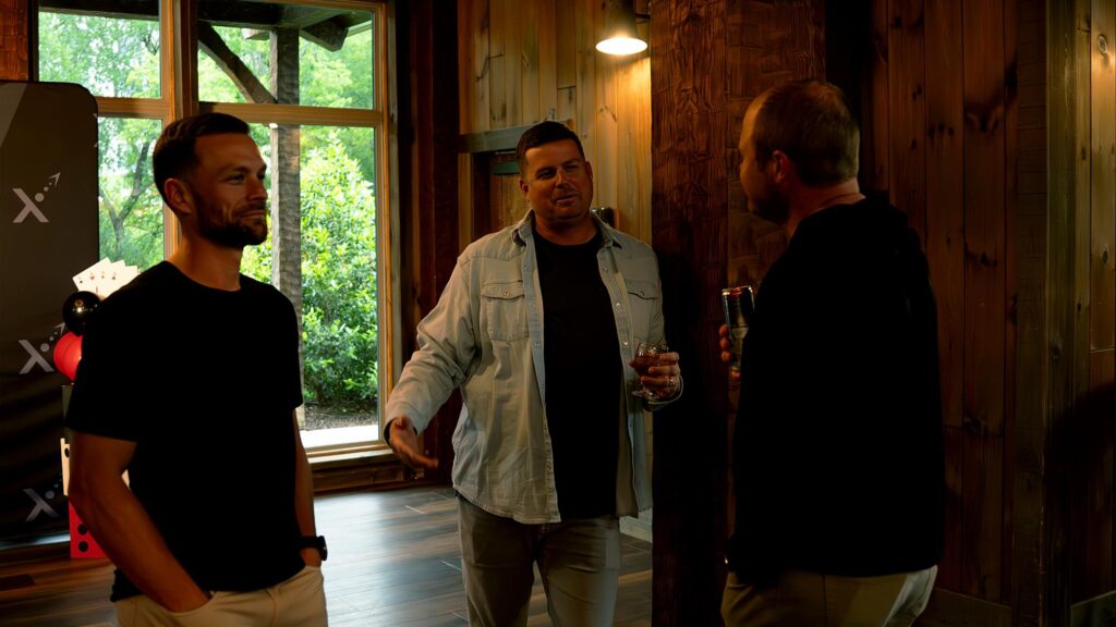 EXM coaches and business owners talking between sessions